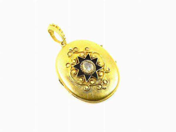 Different yellow gold alloys locket pendant with black enamel and diamond