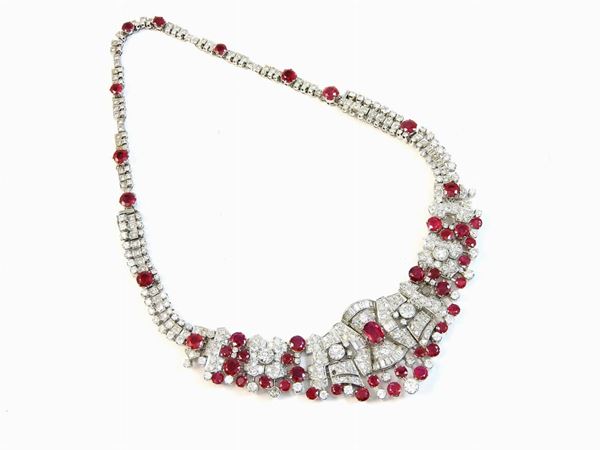 Parure of white gold necklace, bracelet and earrings with diamonds and rubies