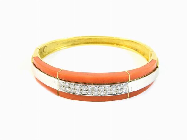 White and yellow gold bangle with diamonds and red coral