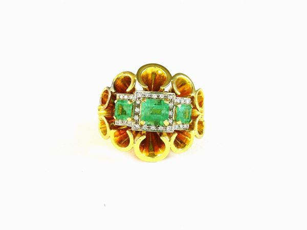 White and yellow gold ring with diamonds and emeralds