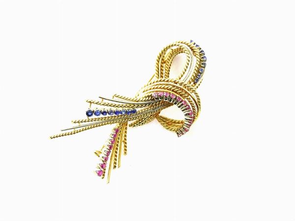 Yellow gold brooch with rubies and sapphires