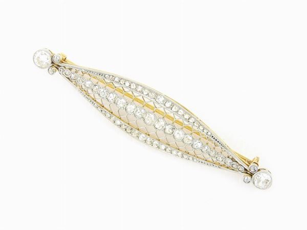 White and yellow gold brooch with diamonds
