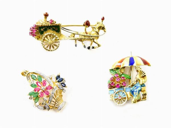 Three yellow gold brooches with enamels, diamonds, rubies, sapphires and emeralds