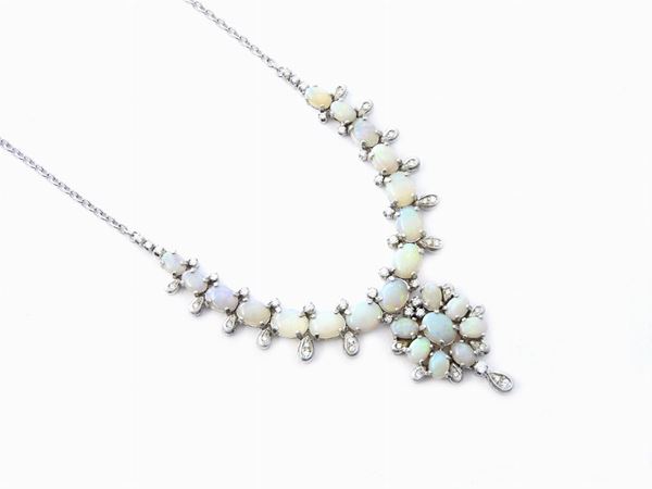 White gold necklace with diamonds and precious opals
