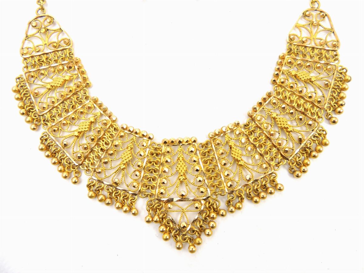 Parure in Metallo Dorato e Strass