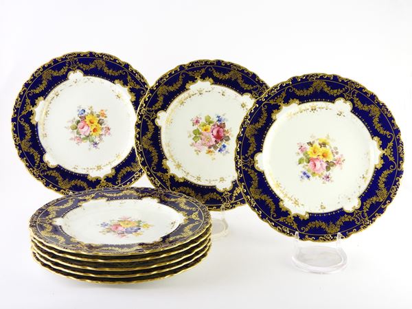 A Set of Eight Painted Porcelain Dishes