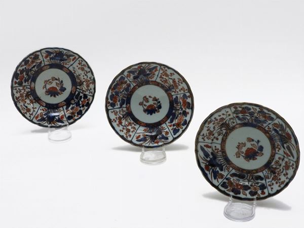 Serie di undici piatti in porcellana Imari