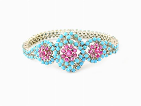 White gold semi rigid bracelet with rubies and turquoises