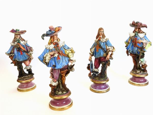 A Set of Four Polychrome Ceramic Figures of The Four Musketeers