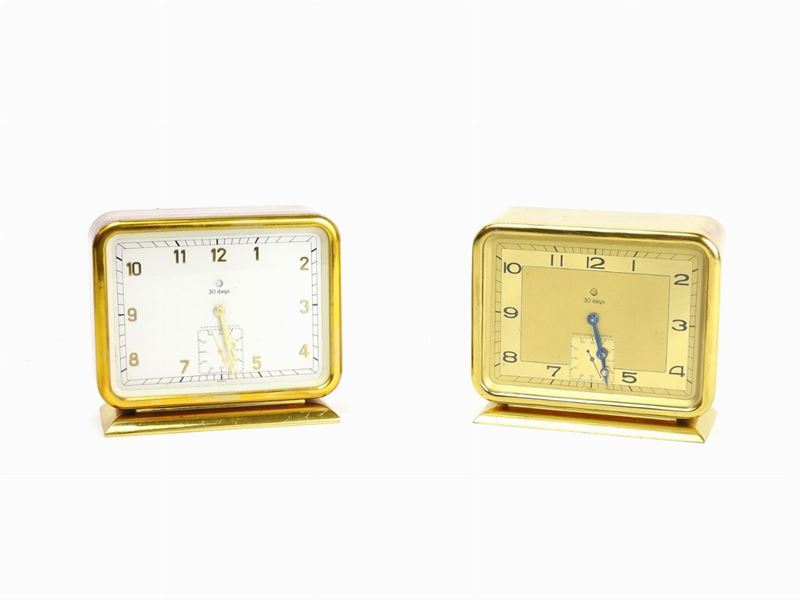 Due Orologi da Tavolo in Metallo Dorato