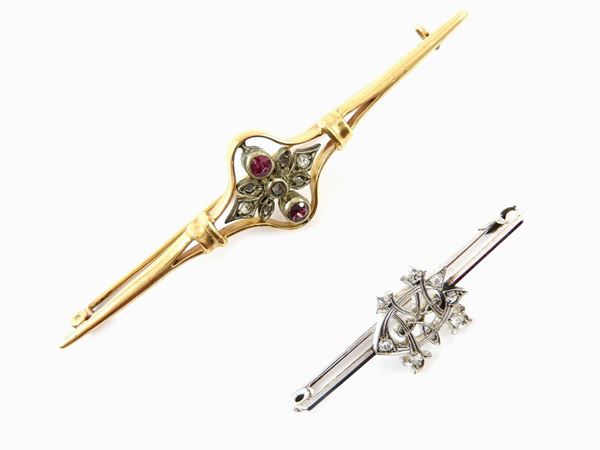 Two silver, white and yellow gold bar brooches with diamonds and rubies