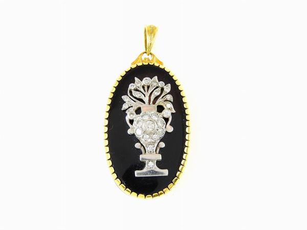 Yellow and white gold locket with diamonds and onyx