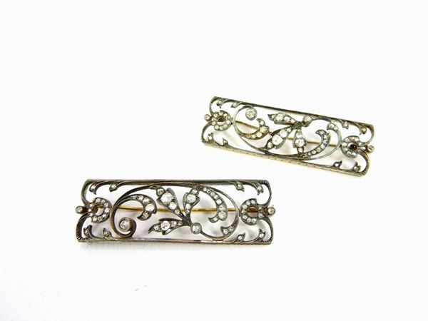Pair of yellow gold and silver lapel pin with diamonds