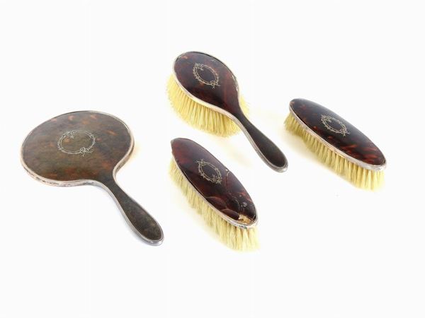 A Four Piece Silver and Tortoise-Shell Toilet Set