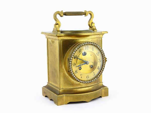 A Brass Table Clock With Barometer