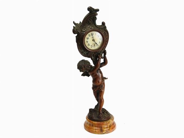 A Patinated Metal Table Clock  (The Jennings Brothers, USA, early 20th Century)  - Auction Furniture and Paintings from a house in Val d'Elsa - Lots 1-303 - I - Maison Bibelot - Casa d'Aste Firenze - Milano