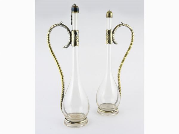 A Pair of Blown Glass and Silver Bottles