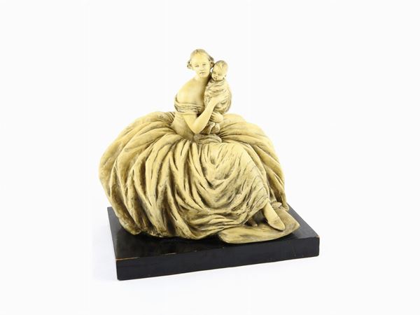 A Patinated Earthenware Figure of a Lady With Child