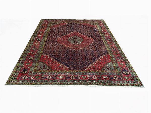 A Persian Meshkin Carpet