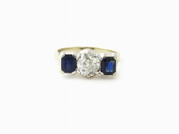 White gold ring with diamond and sapphires