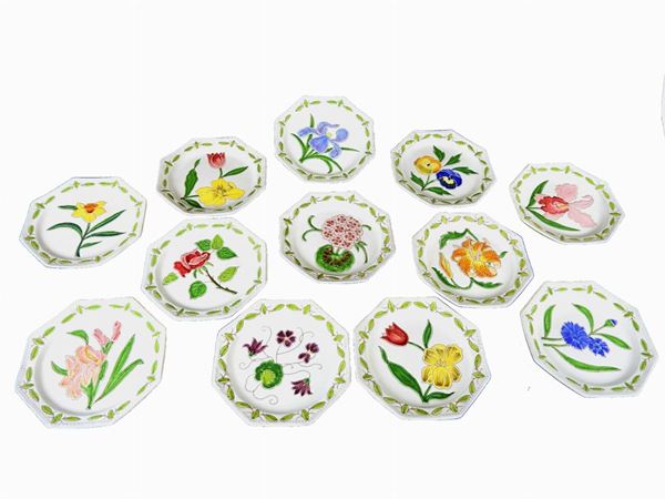 A Set of Twelve Painted Ceramic Dessert Plates
