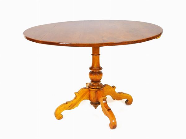 A Round Tilt-top Walnut Table