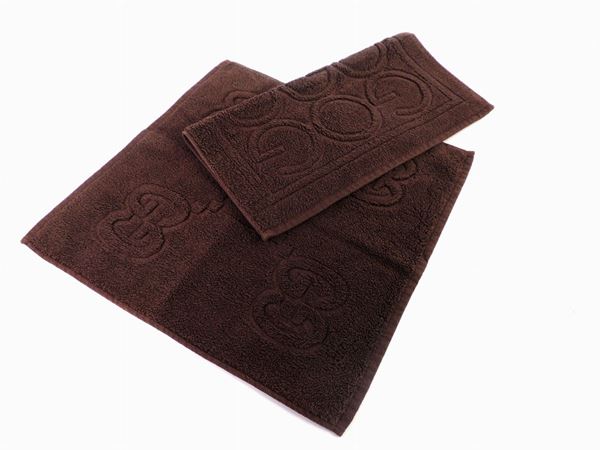 Two brown cotton towels, Gucci
