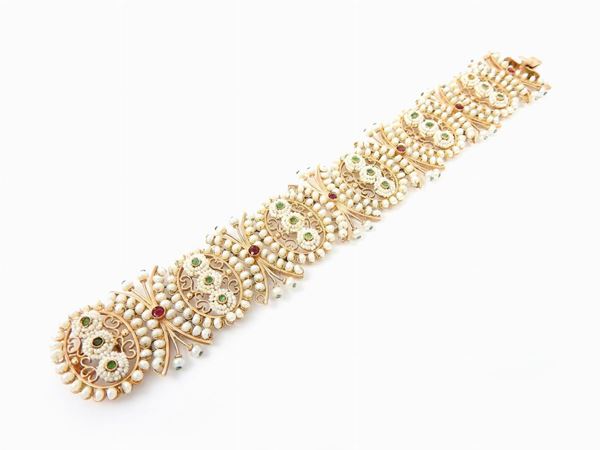 12 kt yellow gold bracelet with seed pearls, rubies and emeralds