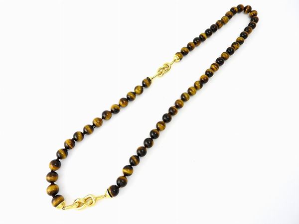 Tiger's eye long necklace with yellow gold ornaments