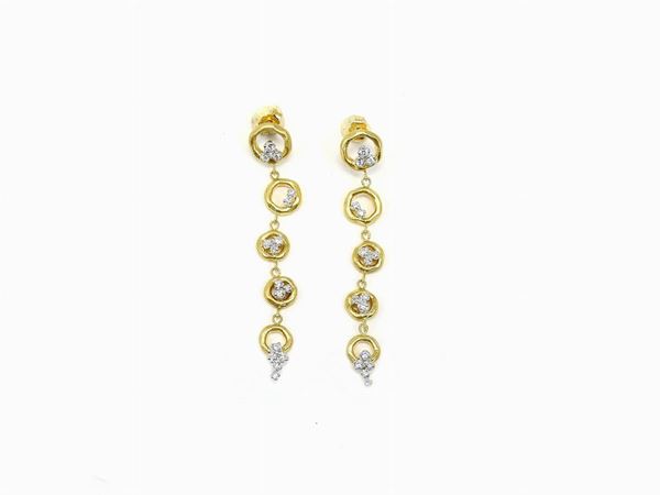 Satin yellow gold and white gold ear pendants with diamonds