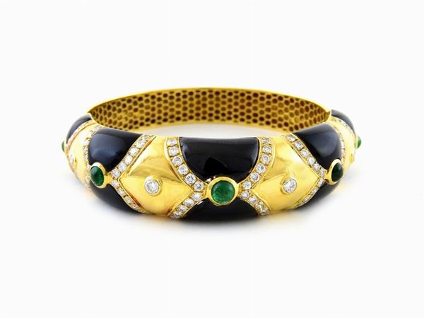 Yellow gold bangle with black enamel, diamonds and emeralds