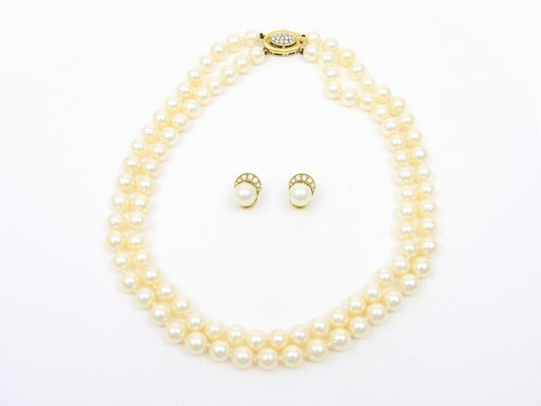 White and yellow gold earrings and two strands Akoya cultured pearls necklace with diamonds