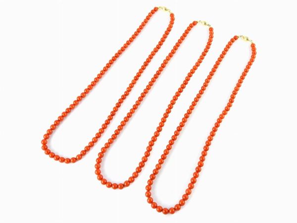 Three red coral necklaces with yellow gold clasps