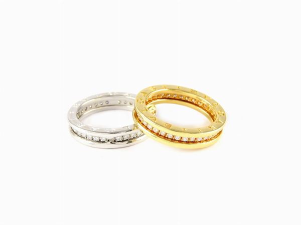 Coppia di anelli a fascia Bulgari in oro giallo e bianco con diamanti