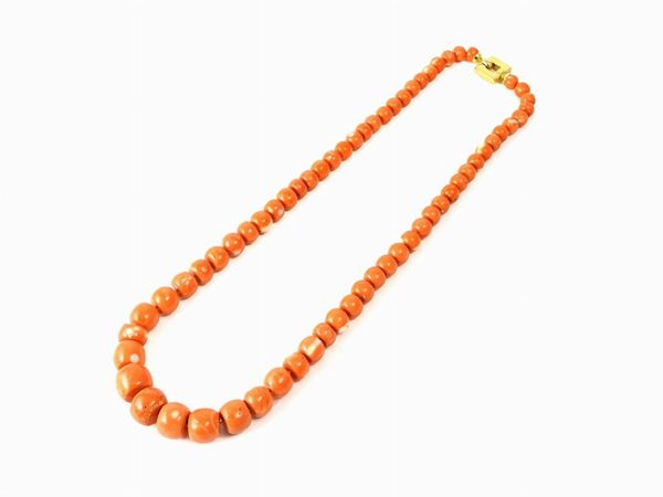 Graduated orange coral necklace with yellow gold clasp