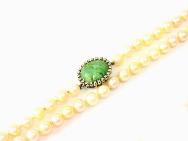 Akoya cultured pearls necklace with white gold clasp set with diamonds and green jade