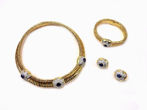 Parure of yellow and white gold "tubogas" necklace, bracelet and earrings with diamonds, sapphires