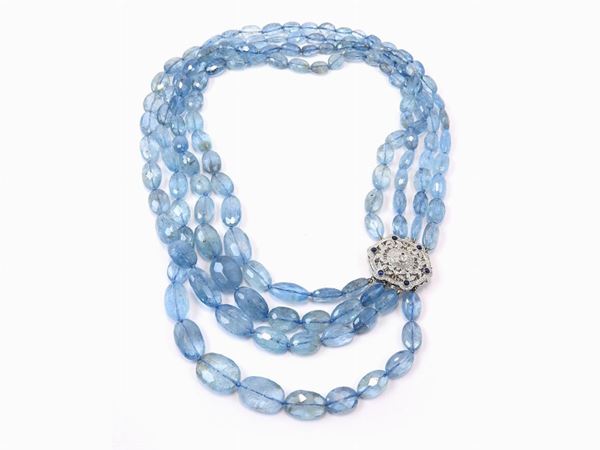 Four strands aquamarine necklace with white gold clasp set with diamonds and sapphires