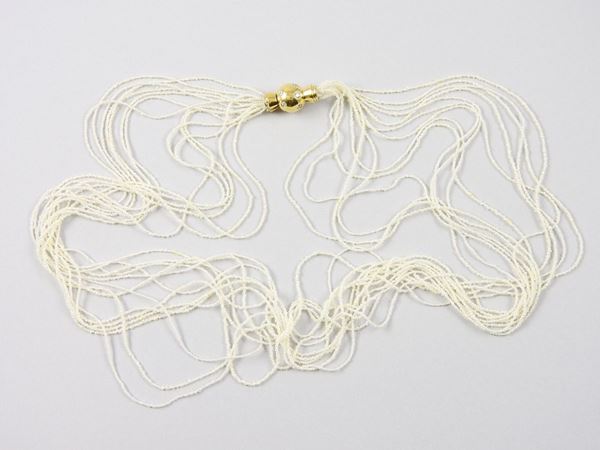 Thirteen strands natural seed pearls necklace with yellow gold clasp set with diamonds