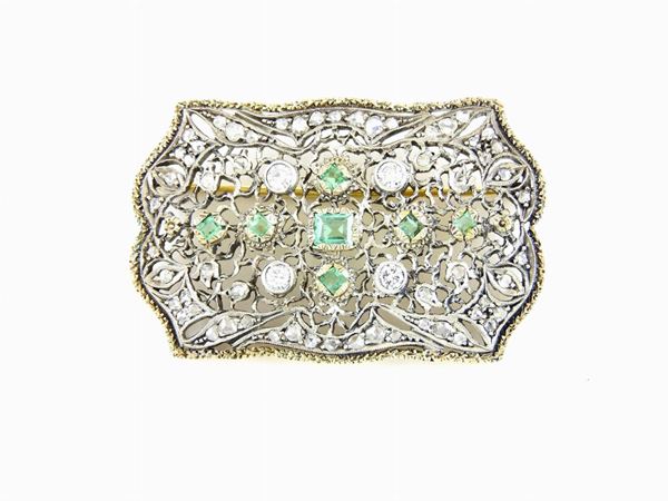 White and yellow gold flat brooch with diamonds and emeralds