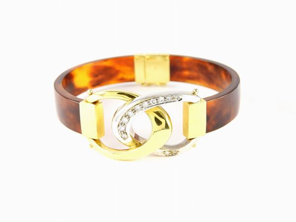 White and yellow gold bangle with diamonds and tortoise shell