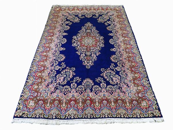 A Persian Kirman Carpet