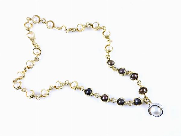 Yellow gold necklace with cultured pearls and white gold pendant with diamonds and pearl
