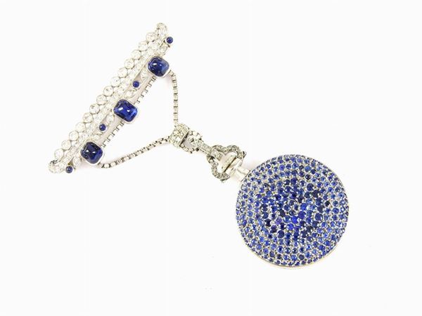 Bar brooch with hanging white gold watch set with diamonds and sapphires