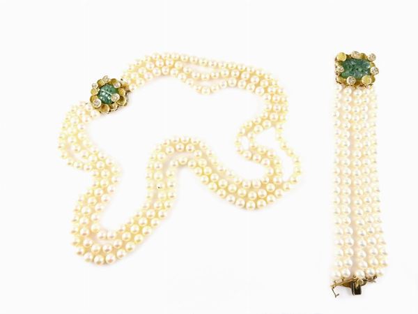 Three and five pearls strands necklace and bracelet, yellow gold clasps set with diamonds and jades