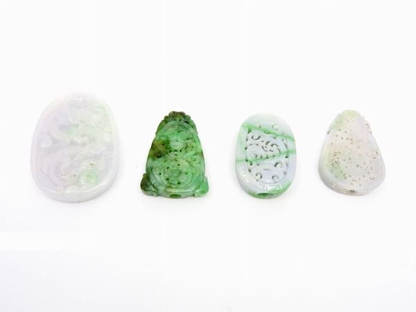 Four green and white carved jades