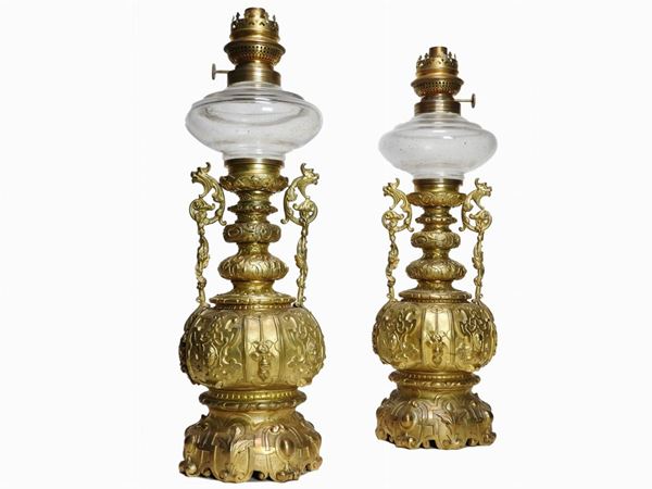 A Pair of Gilded Metal Oil Lamps