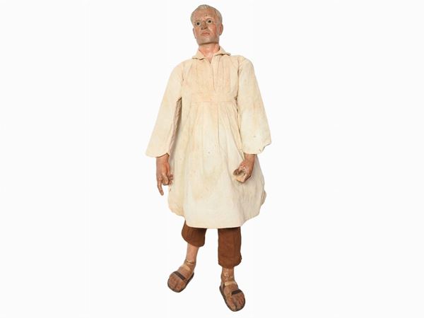 A Polychrome Wooden Figure of a Man