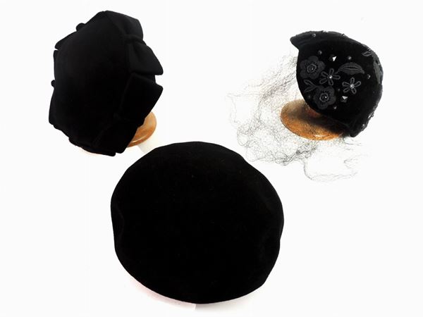 Three black velvet and fabric hats