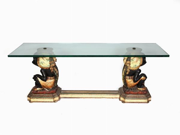 A Polychrome Wooden Coffee Table with Crystal Top